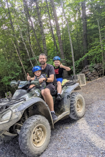 kids and dad on 4 wheeler