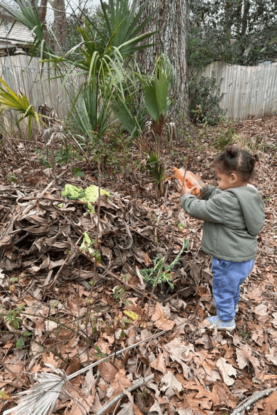 kid playing in nature, compost