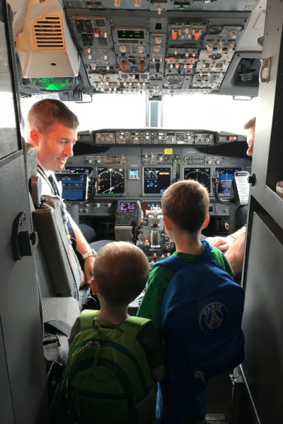 CHS Airport: a pilot allows two young boys to check out the cockpit